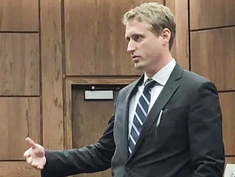 An attorney standing in in front of the court and passionately explaining