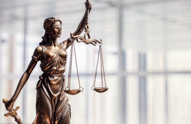 Statue of Lady Justice with scales of justice