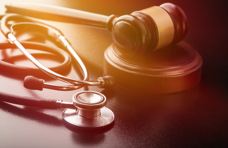 Wooden gavel and stethoscope