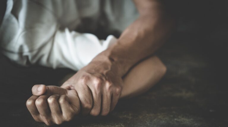 male hand holding a woman hand for rape and sexual abuse